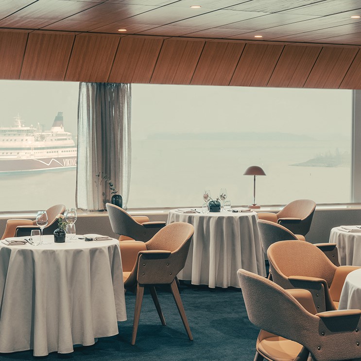 Inside Palace Restaurant in Helsinki with sea view and chair in Sørensen Leather SPECTRUM Camel
