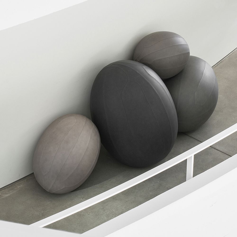 Oval balls in light and dark grey leather co-created with Space Copenhagen
