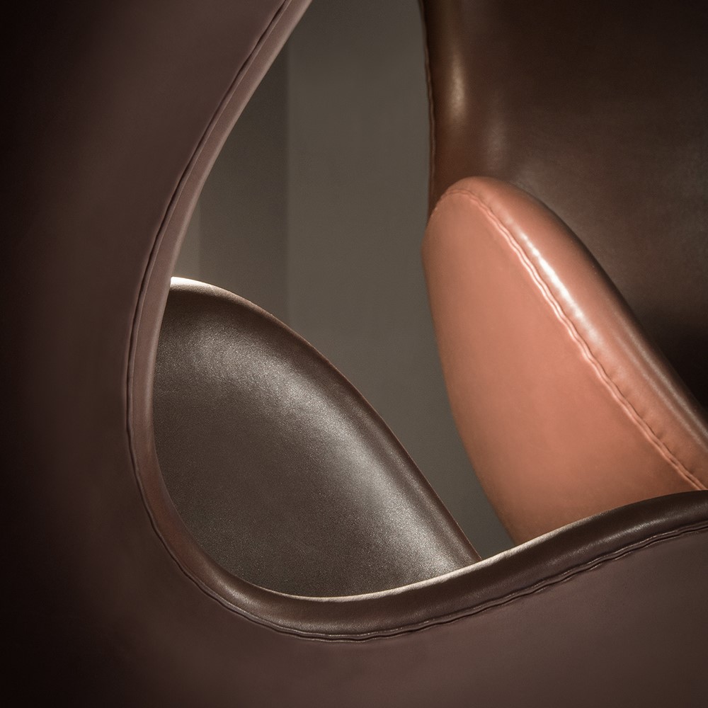 Close-up of Arne Jacobsen's Egg™ chairs from Fritz Hansen crafted with brown Sørensen Leather