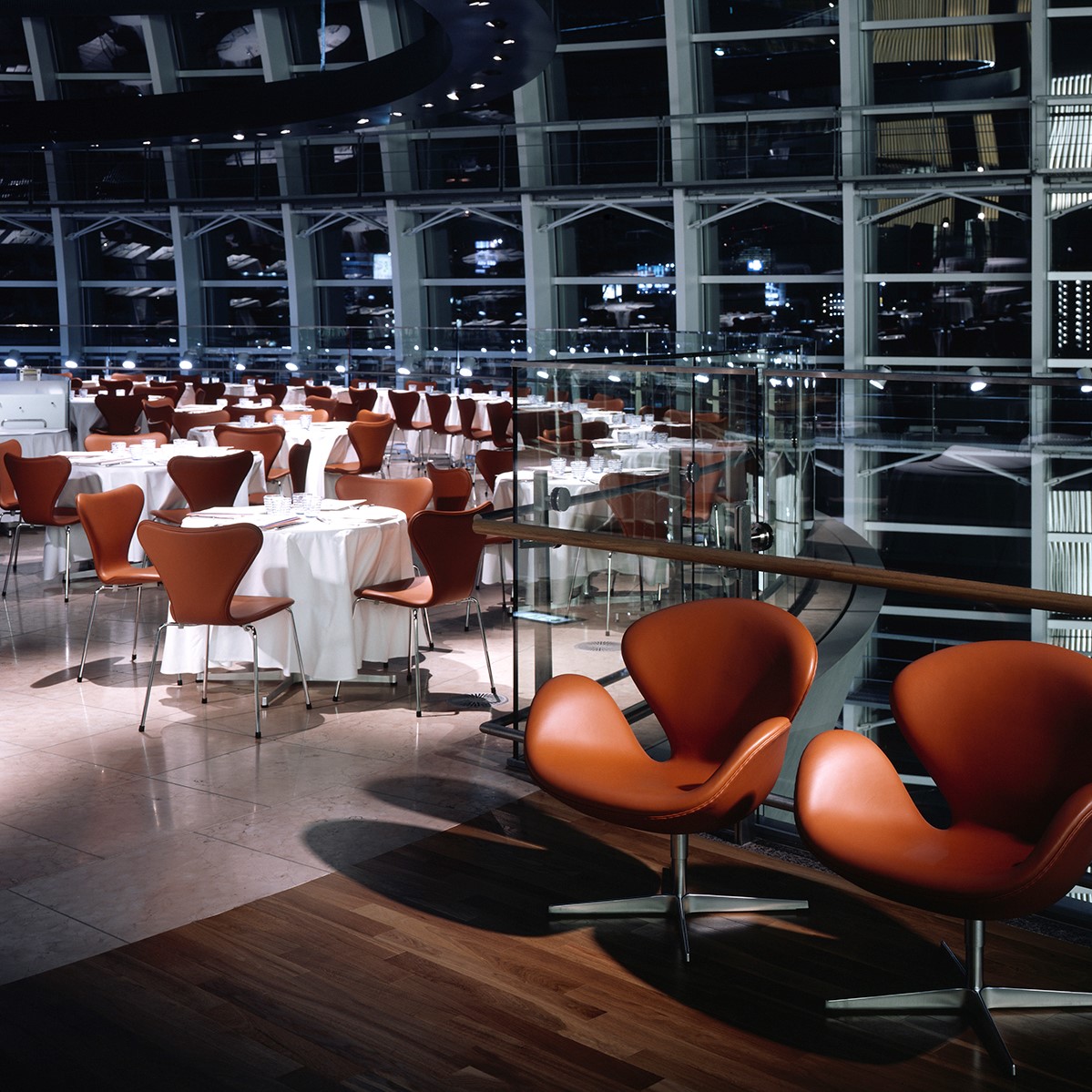 Tower restaurant inside the National Art Center in Tokyo set up with eries 7™ chairs and Swan™ chairs by Arne Jacobsen