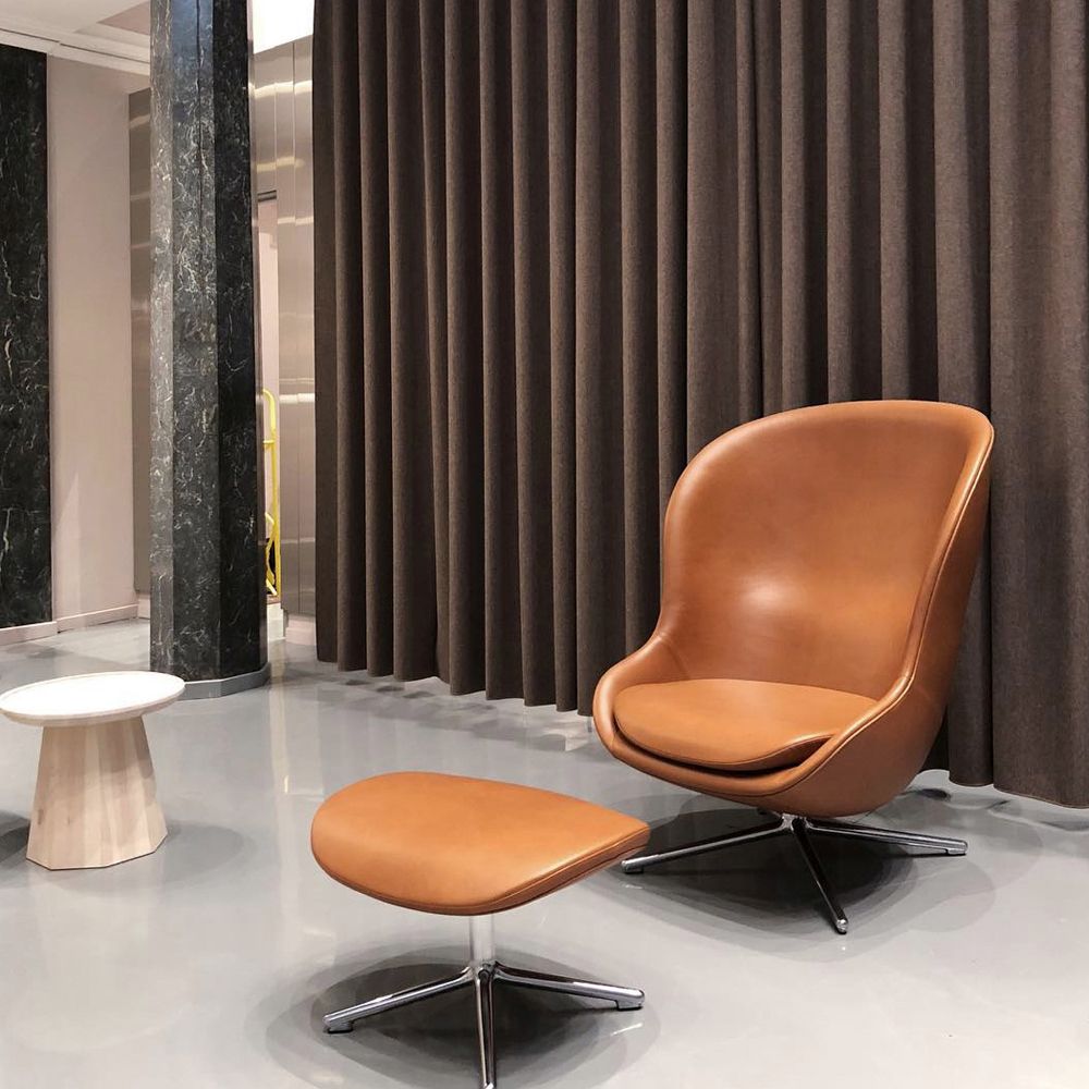 Cognac leather lounge chair with a footstool