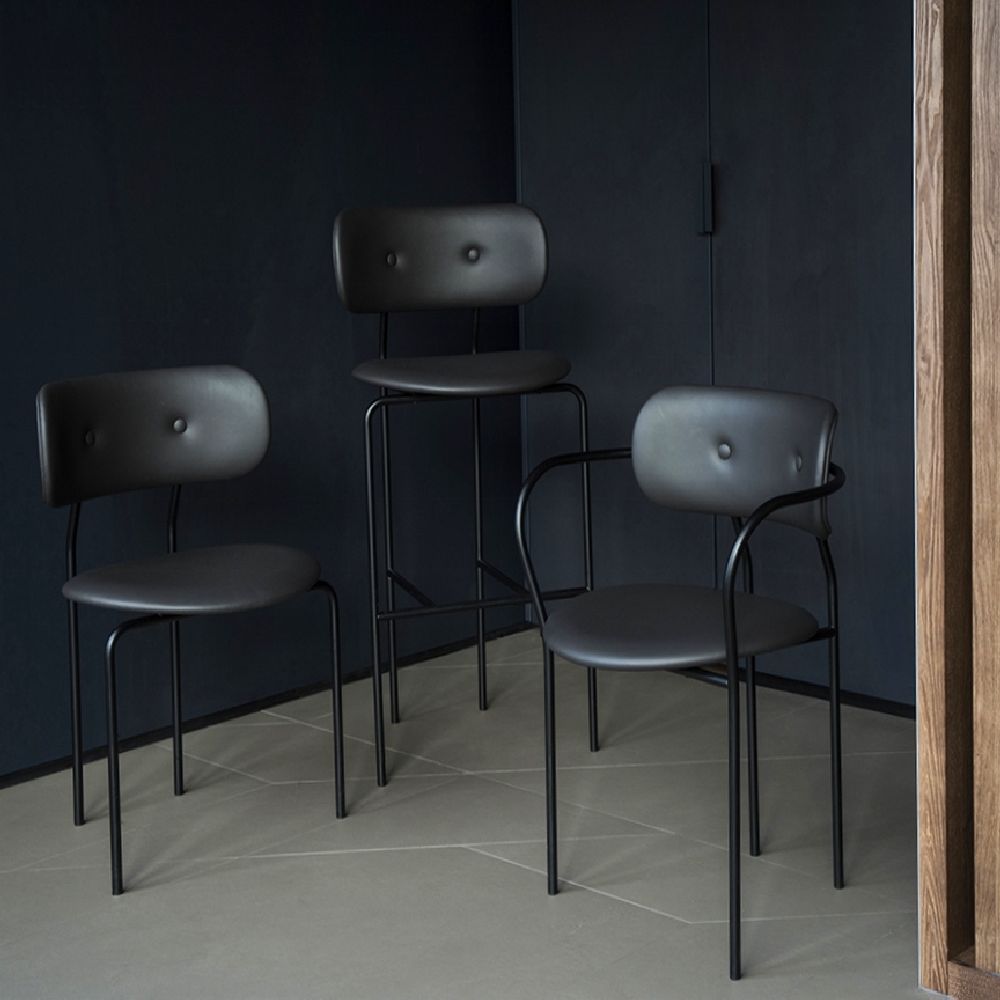 Black leather chairs and bar stool