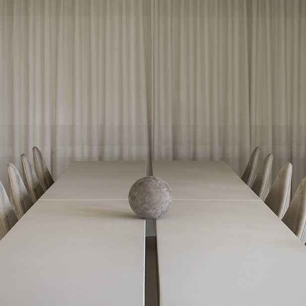 Sørensen Leather conference room with beige curtains and a light grey conference table and chairs in leather