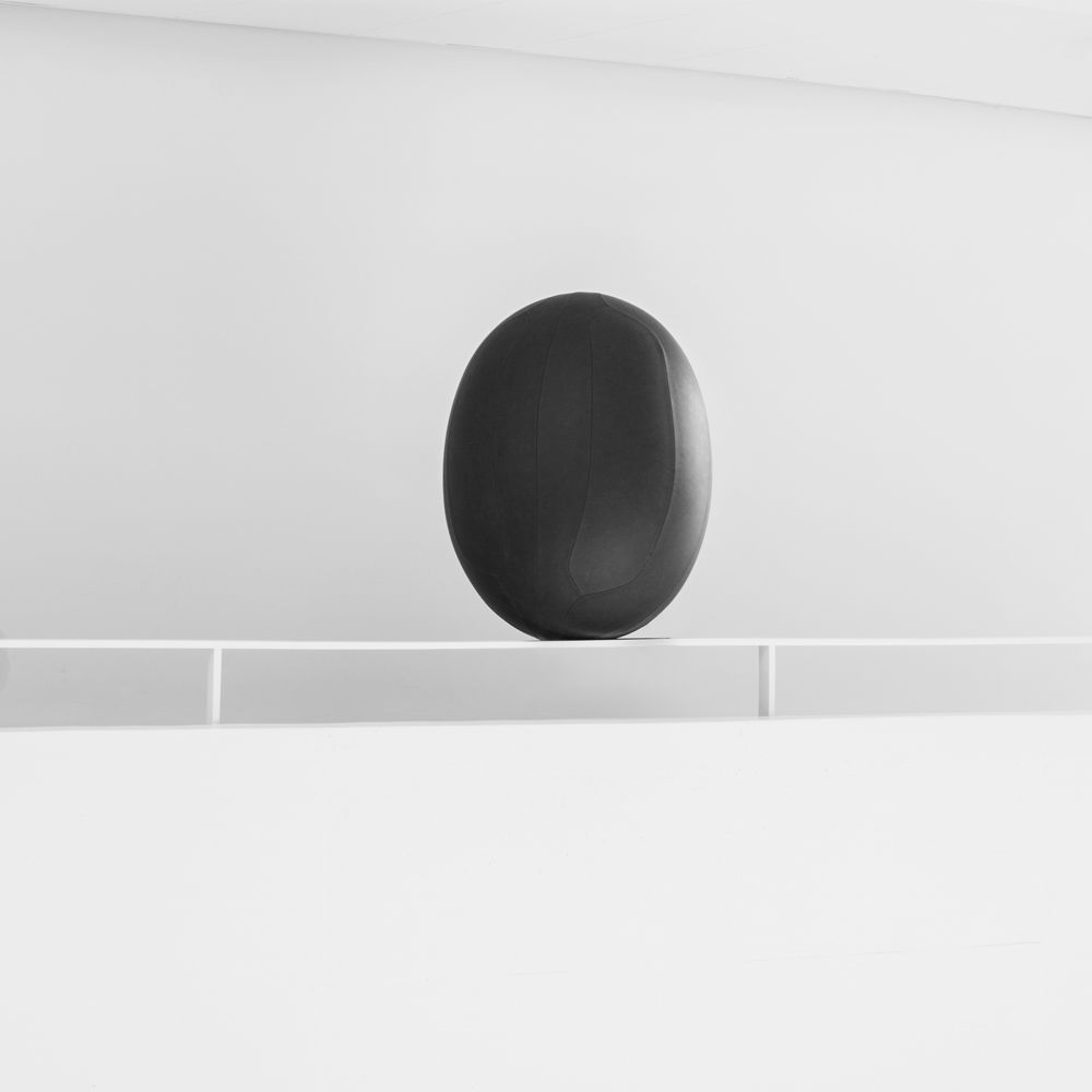 Oval ball in dark grey leather at ARoS Aarhus Art Museum