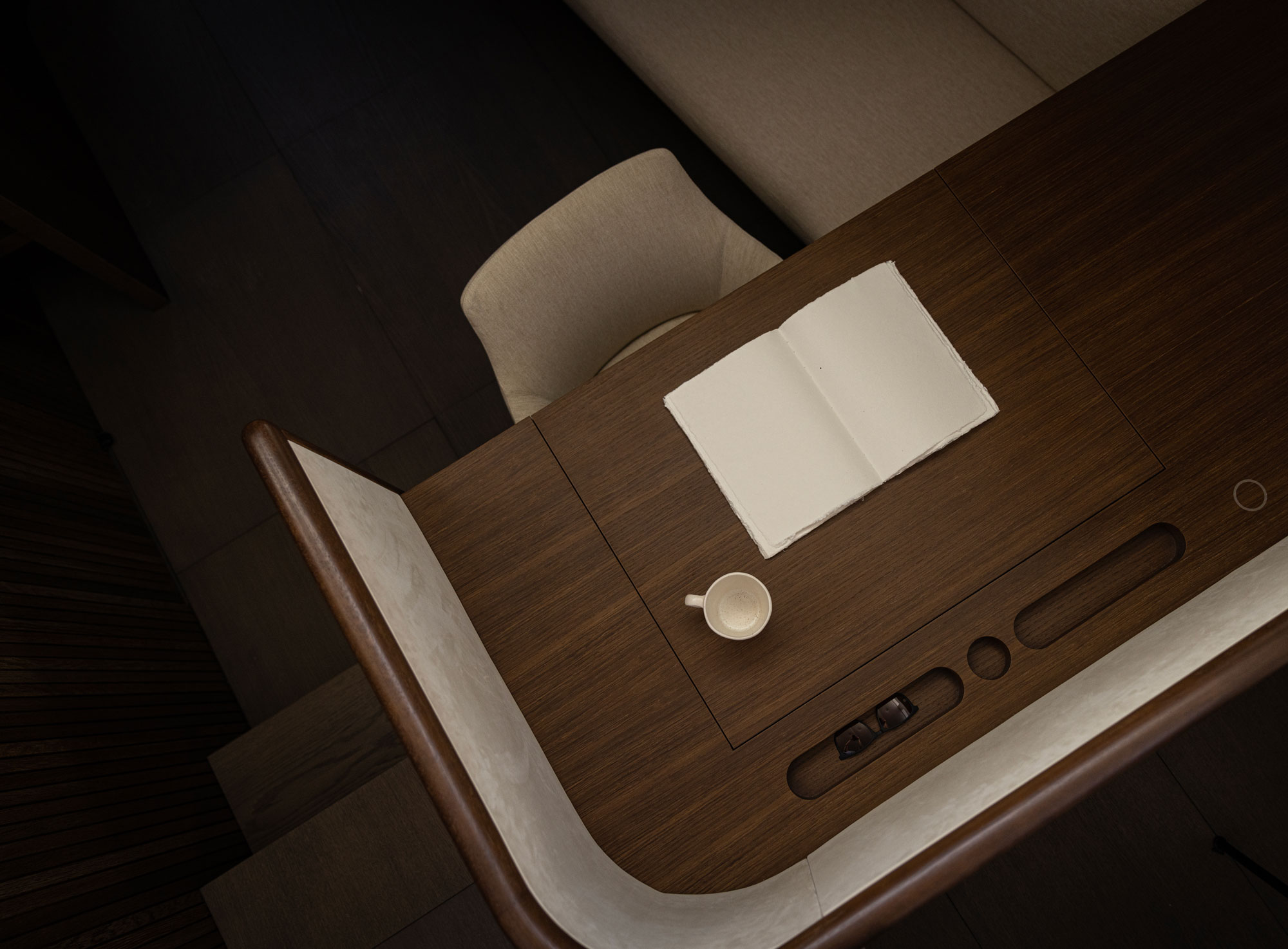 The workstation is kept simple with a room divider crafted with leather.